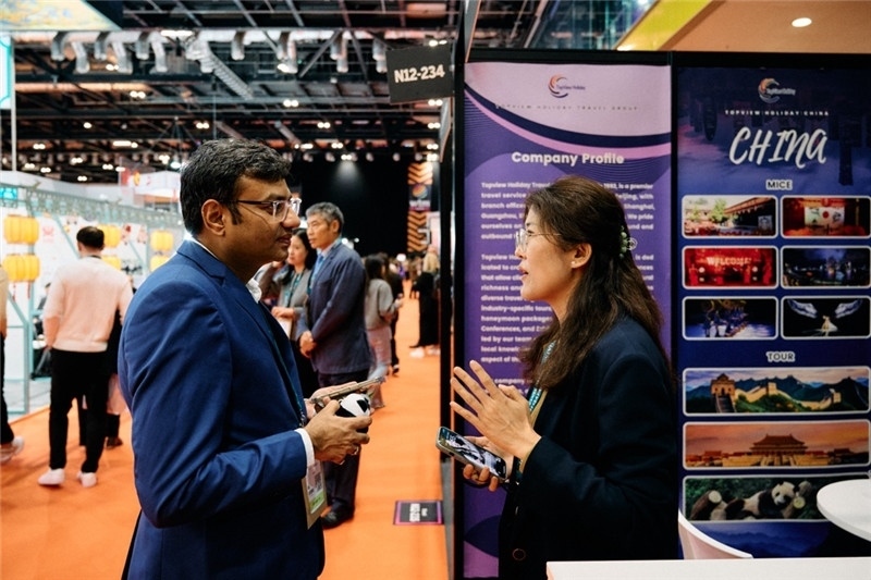 “中國(guó)館”展區(qū)現(xiàn)場(chǎng)洽談。 楊浩鵬攝